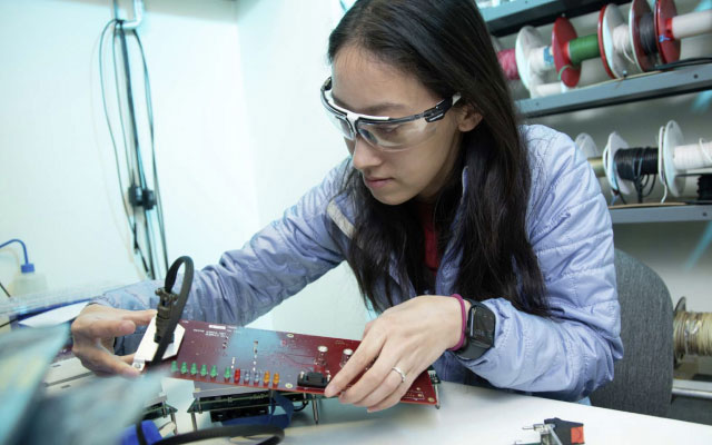 A student working on electronics.