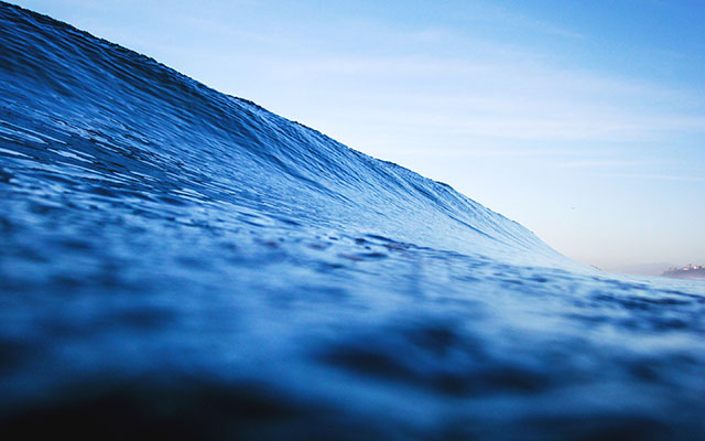 A blue wave on the ocean.